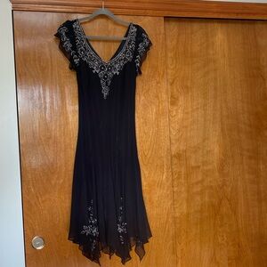 Black dress with beautiful sequins and beaded detail.  Like new.